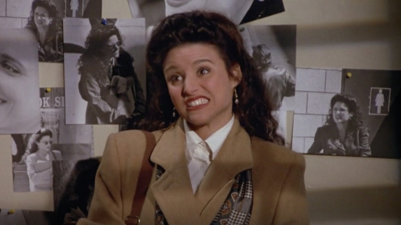 Elaine wearing a brown coat