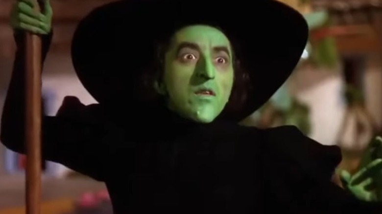 The Wicked Witch of the West holding her broom