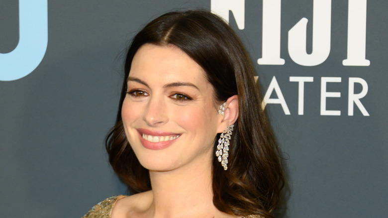 Anne Hathaway with diamond earring smiling