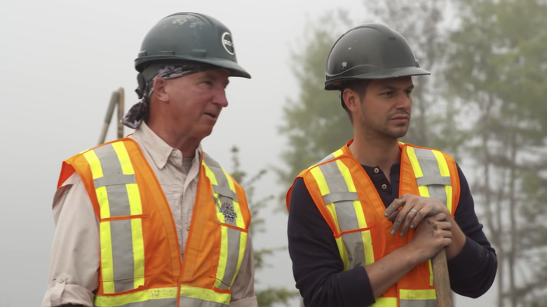 Gary and another worker looking skeptical