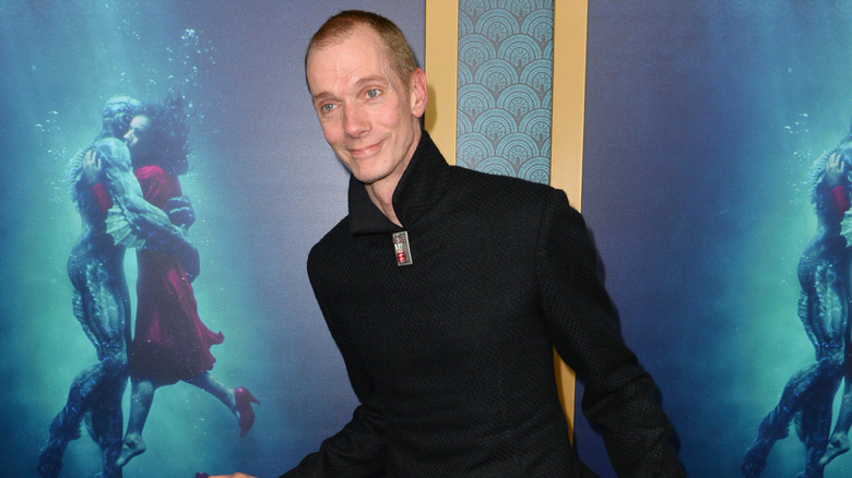 Doug Jones pretending to dance during film premiere