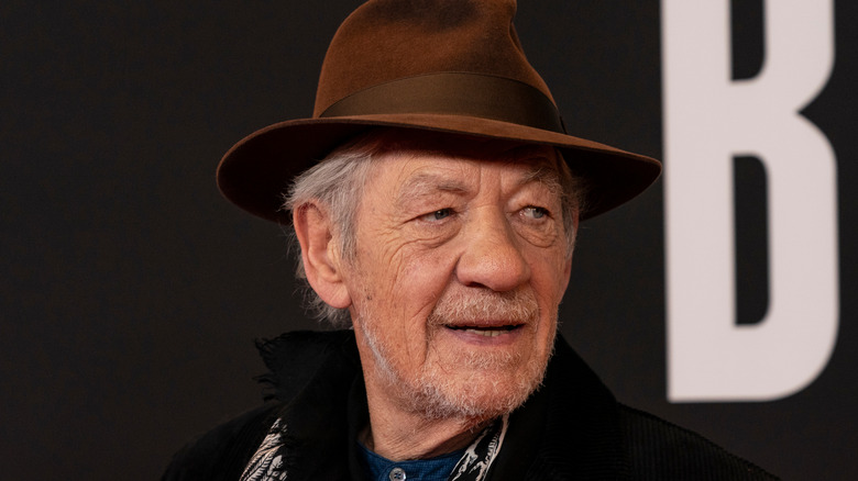 Ian McKellen looking over his shoulder at film premiere