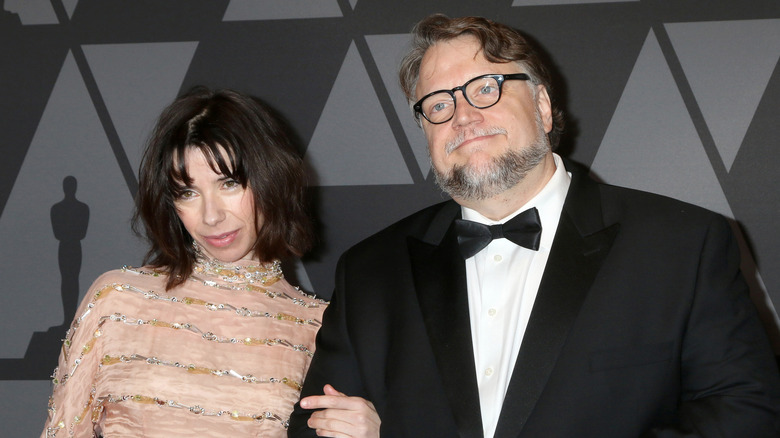 Guillermo del Toro and Sally Hawkins locking arms at premiere