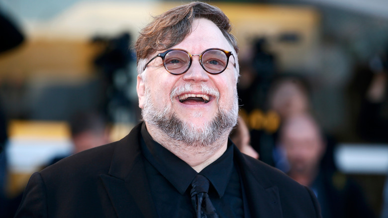 Guillermo del Toro smiling widely at film premiere