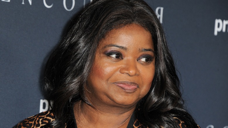 Octavia Spencer smiling and looking over her shoulder at premiere