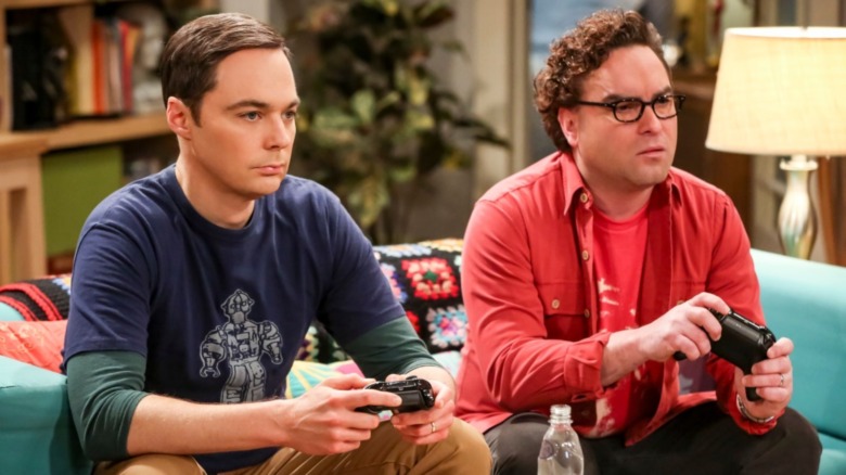 Leonard and Sheldon play video games. 
