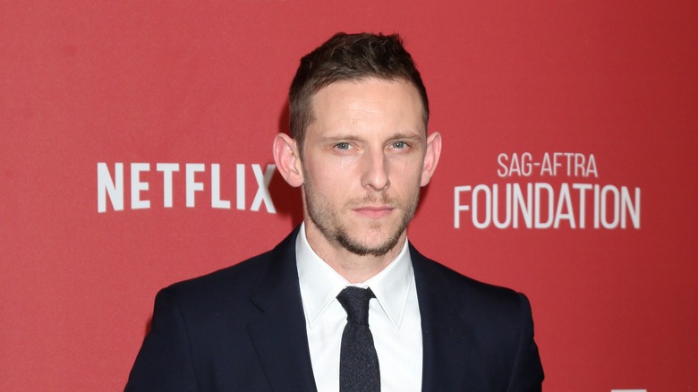 Jamie Bell poses at event 