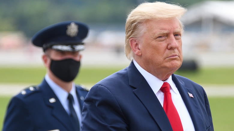 President Donald Trump glances at the camera