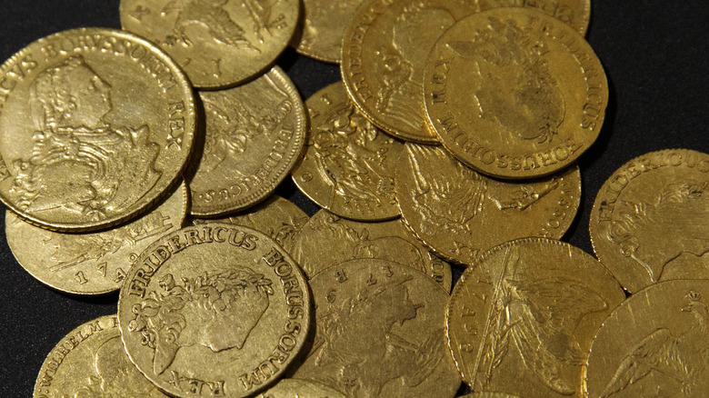 Antique gold coins sit on display in the German national gold reserve exhibition inside the Deutsche Bundesbank in Frankfurt, Germany, on Friday, April 13, 2018.