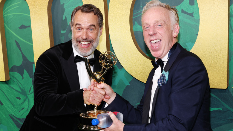 Murray Bartlett and series creator Mike White, smiling and sharing Bartlett's Emmy Award