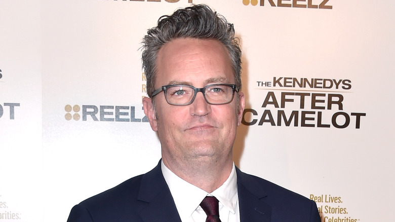 Matthew Perry smirking