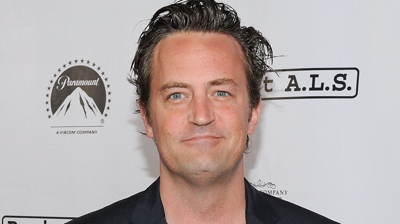 Matthew Perry smirking