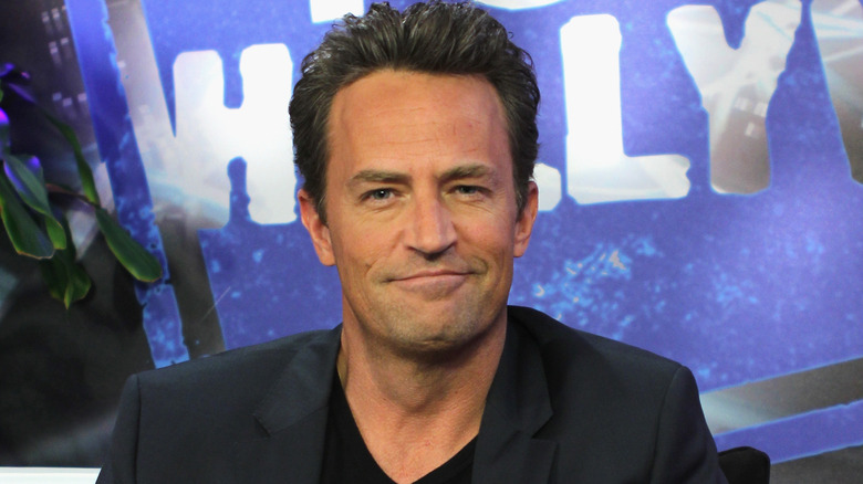 Matthew Perry smirking