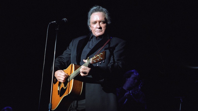 Johnny Cash playing guitar