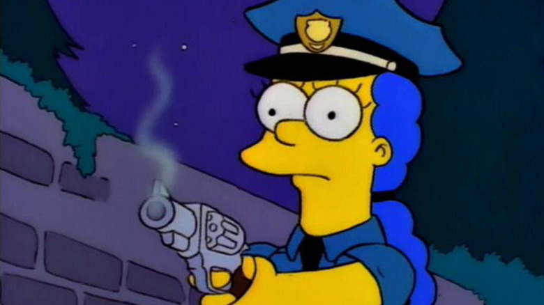 Marge at an officer holding a gun