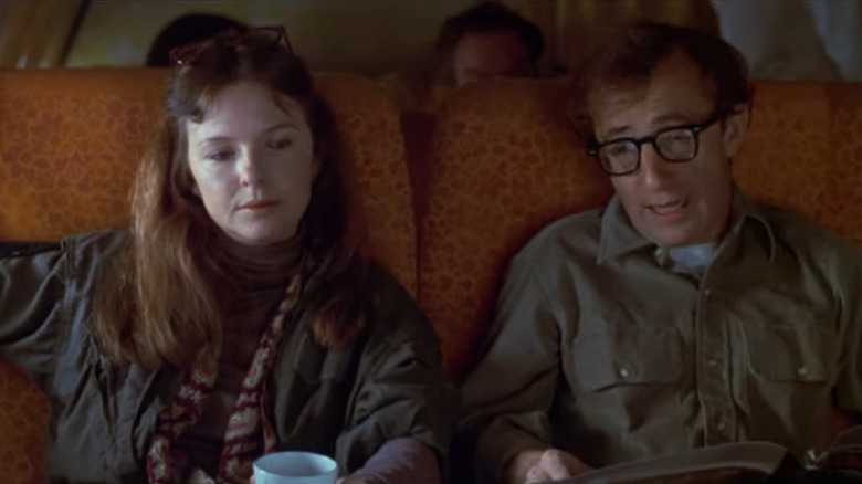 Diane Keaton and Woody Allen sitting on a plane