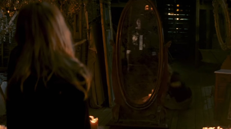 Mama Cecile in Caroline's mirror