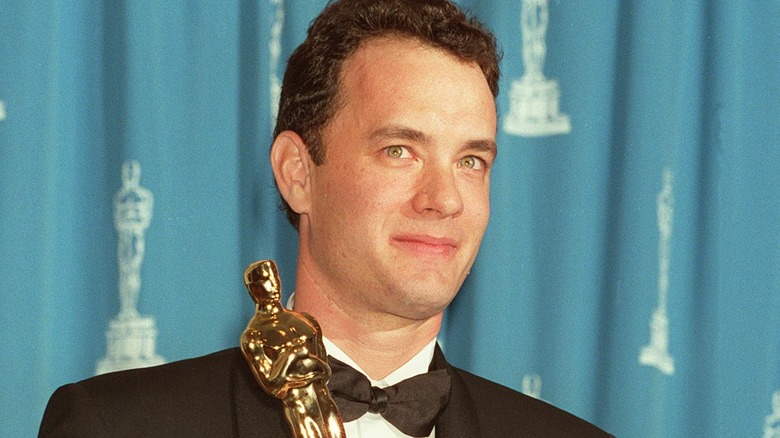 Tom Hanks holding Forrest Gump Oscar