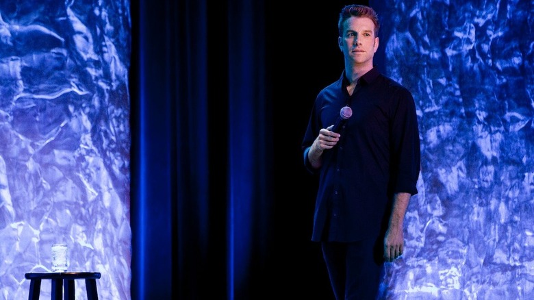 Anthony Jeselnik performing on stage