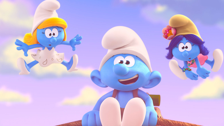 Smurfette and two other Smurfs jumping in the air