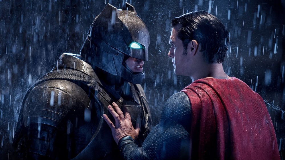 Superman trying to calm Batman down