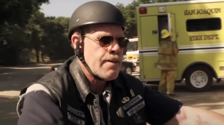 Ron Perlman riding a motorcycle