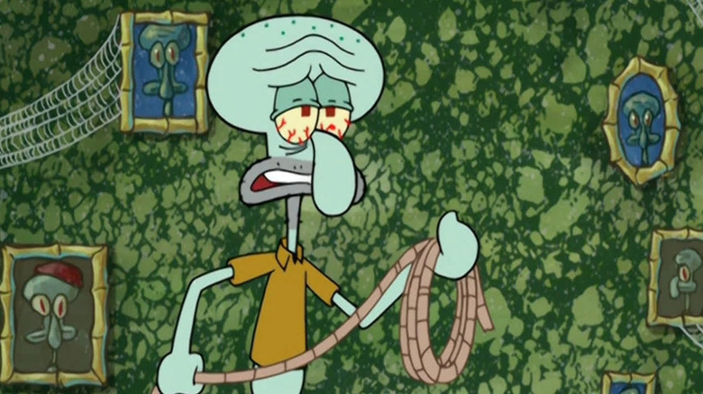 Tired Squidward holding a rope