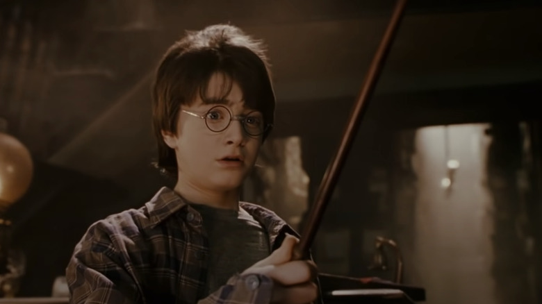 Harry looking at his wand