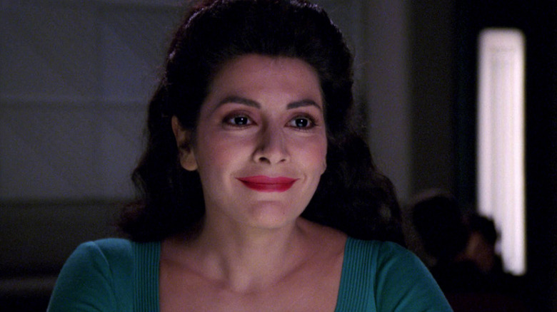 Deanna Troi smiles