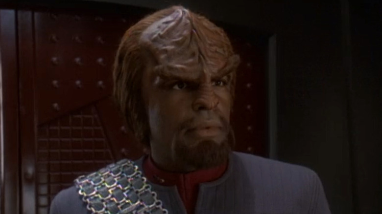 Worf standing in shadow