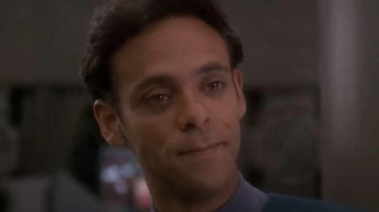 Julian Bashir smiling skeptically