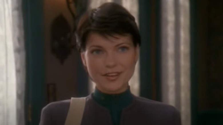 Ezri Dax smiling eagerly