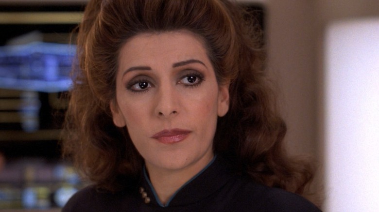 Troi prepares to put Geordi in danger