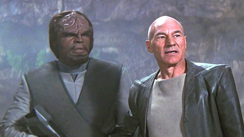 Picard and Worf standing in a forest