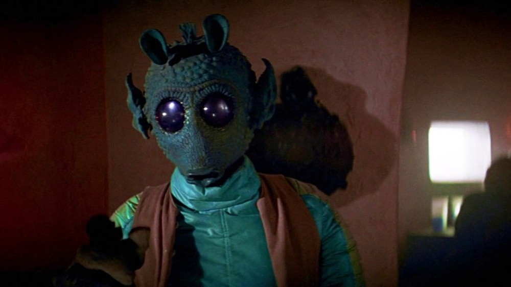 Greedo sitting at table