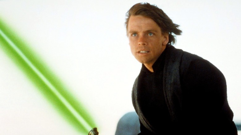 Luke Skywalker and his green lightsaber