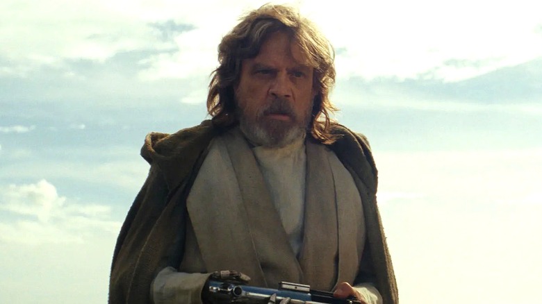 Luke Skywalker holding lightsaber