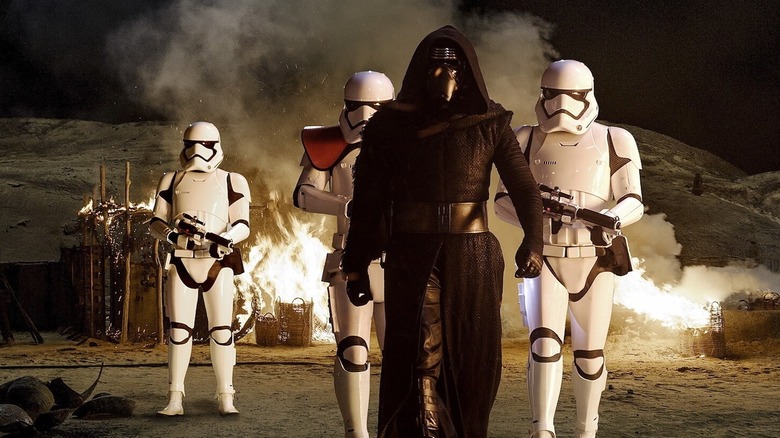 Kylo Ren walking with Stormtroopers