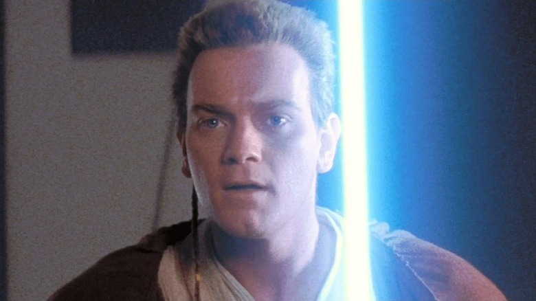 Obi-Wan Kenobi holding his lightsaber