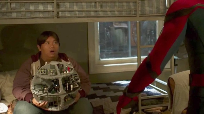 Jacob Batalon holding Death Star LEGO in Spider-Man: Homecoming