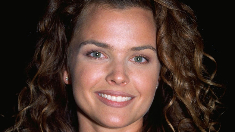 Dina Meyer poses at an event