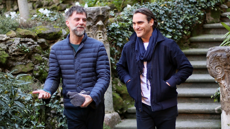 Paul Thomas Anderson and Joaquin Phoenix laughing 