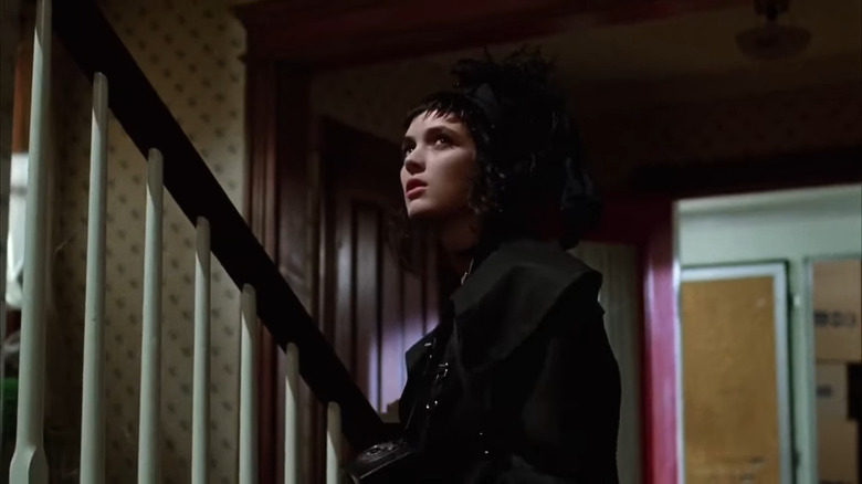 Lydia Deetz walking up stairs