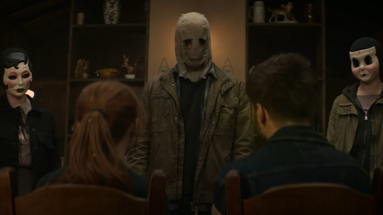 The strangers wearing masks