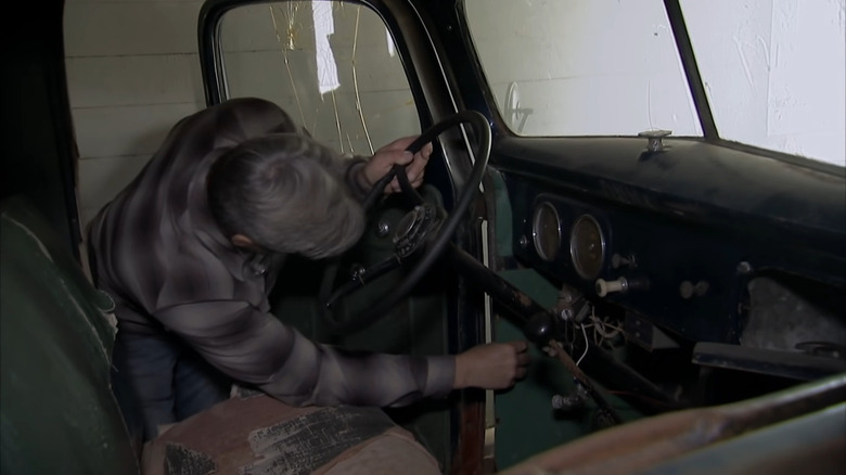 Robbie Wolfe inspecting a truck