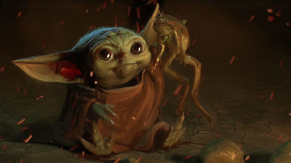 Baby Yoda (Grogu) gets ready to eat a frog in some Mandalorian concept art