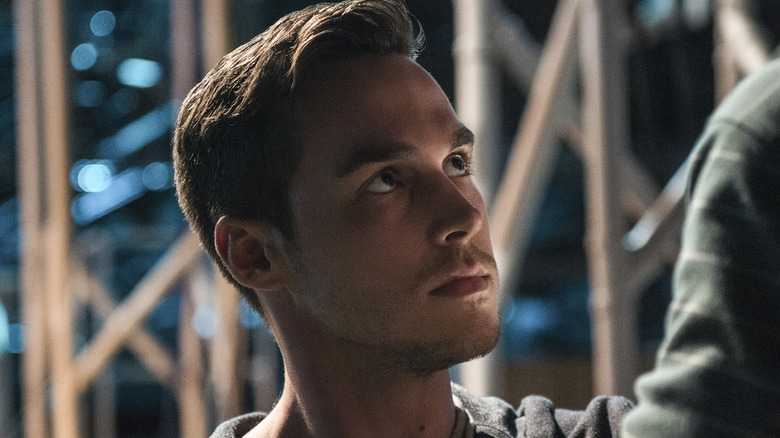 Mon-El looking up at something 