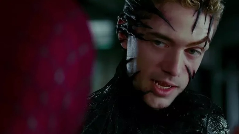 Eddie Brock showing fangs