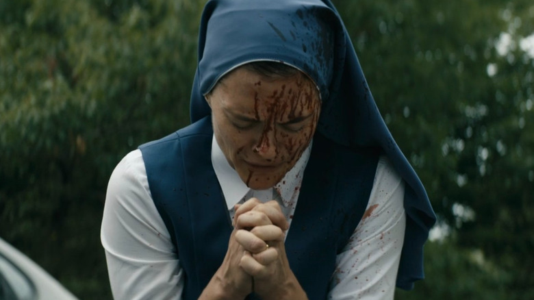 Bloody nun praying