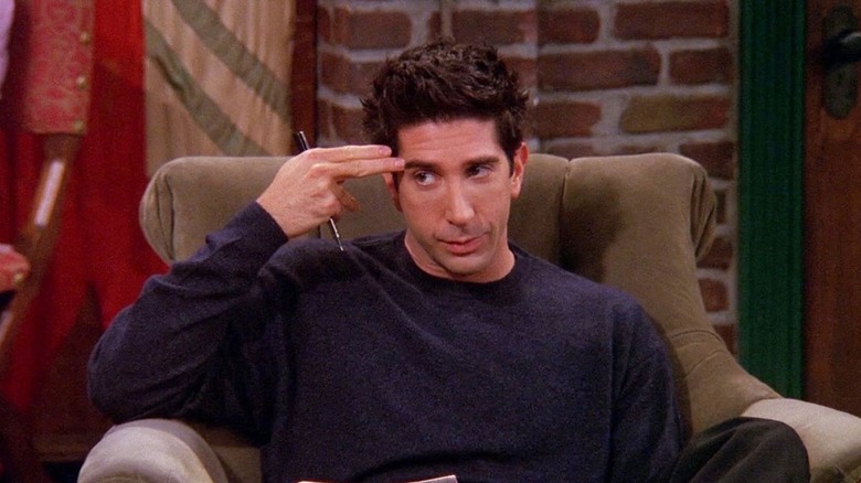 Ross Geller holding finger to head